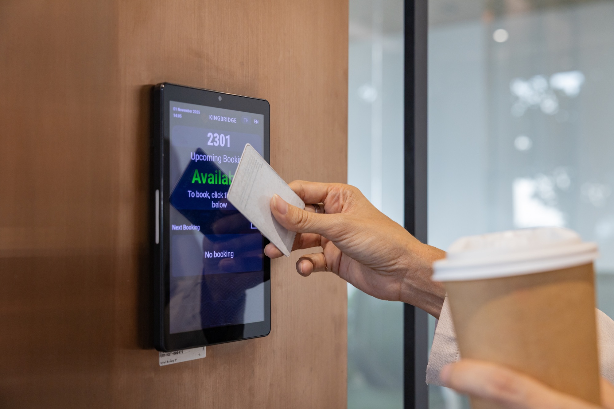 Access card being presented at a commercial facility reader